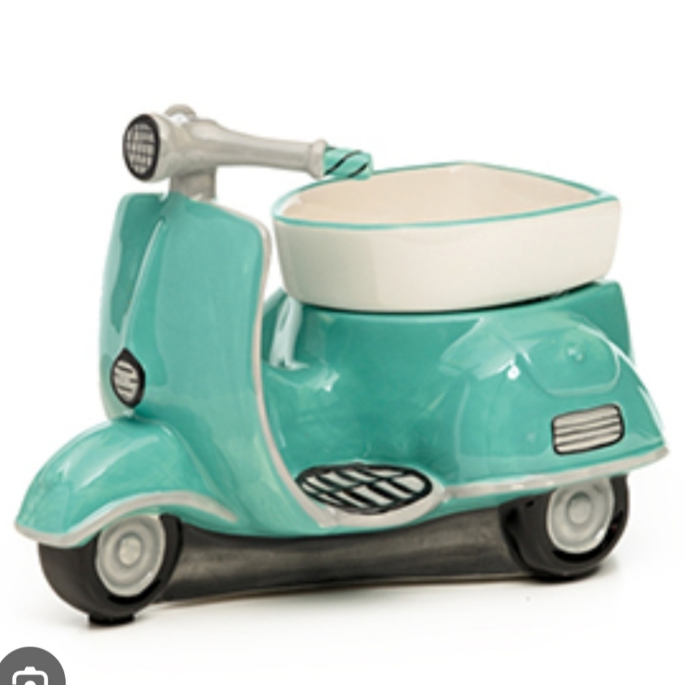This is a Scentsy brand new warmer scooter Around Town
